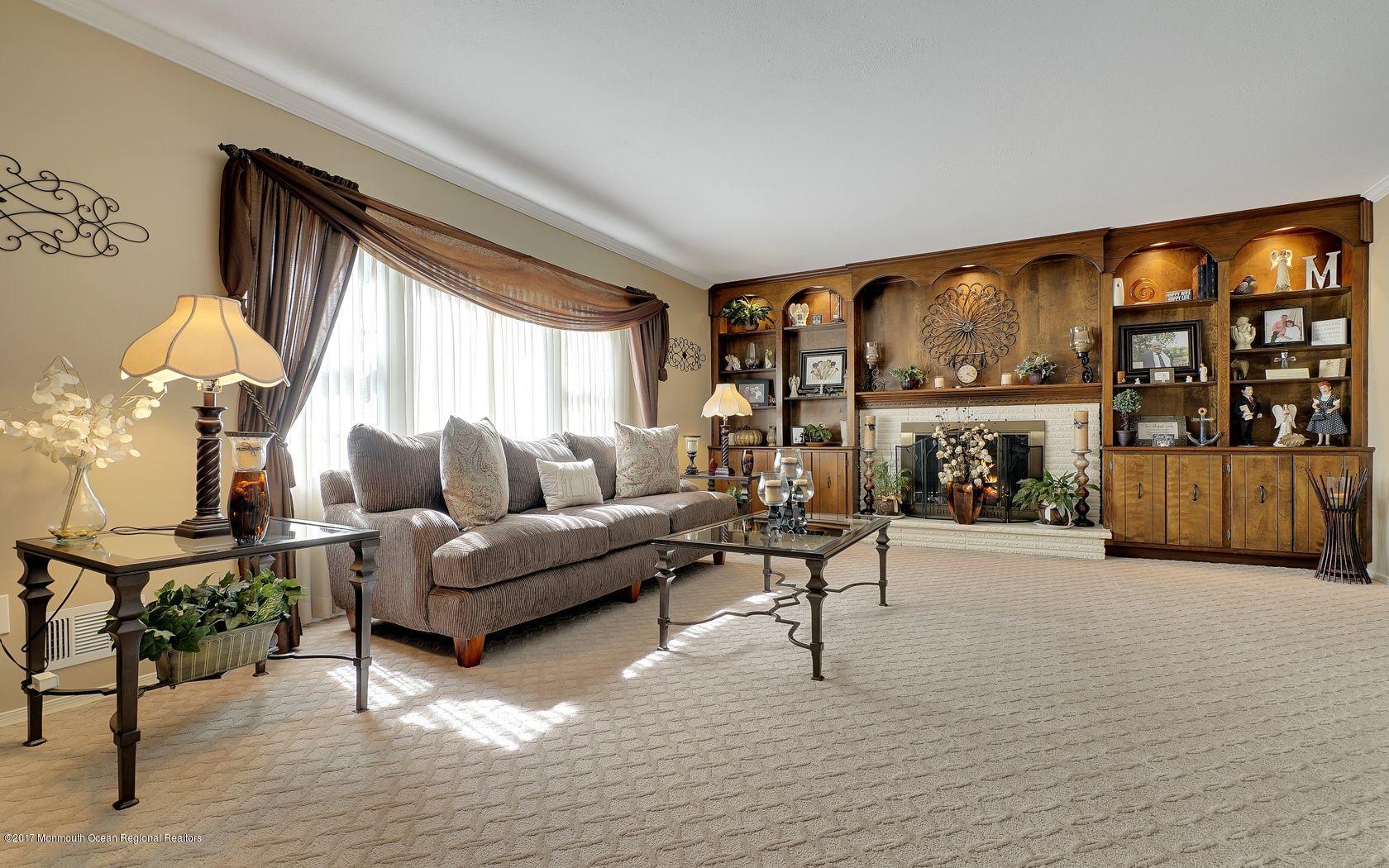 9 Cornwall Road Freehold, NJ 07728 - Photo 9 of 38 a living room with furniture and a large window