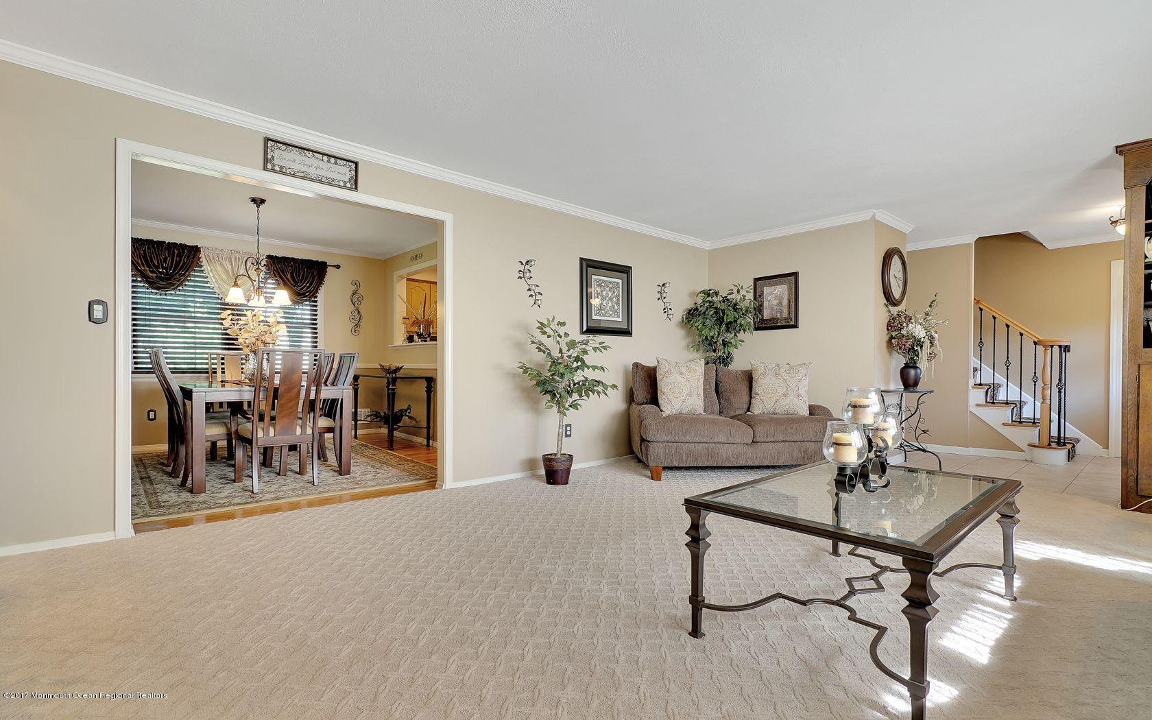 9 Cornwall Road Freehold, NJ 07728 - Photo 10 of 38 a living room with furniture and a table