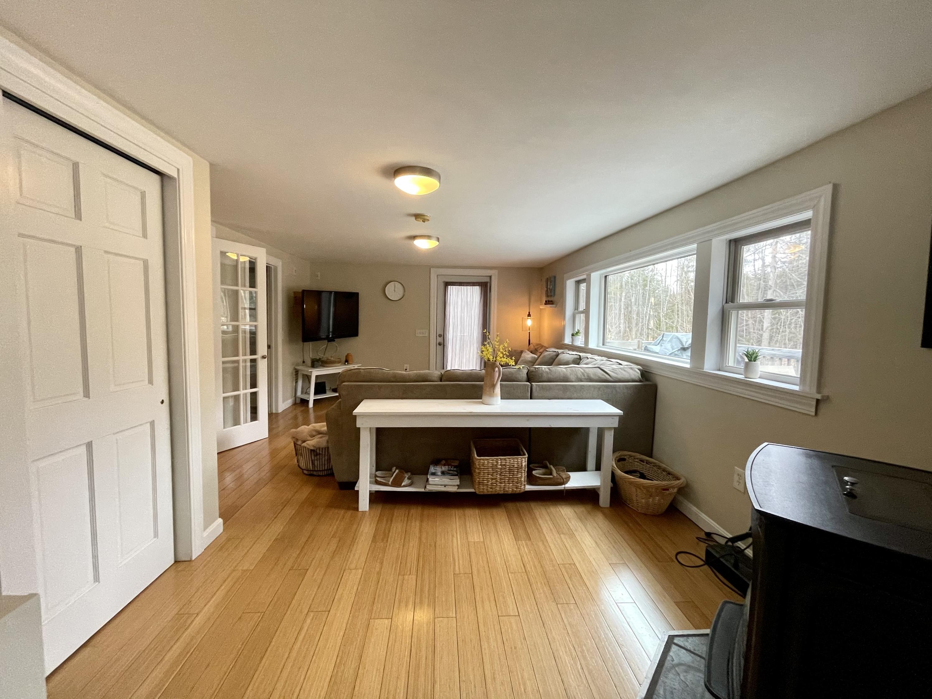 58 Meadow Road Hampden, ME 04444 - Photo 7 of 16 Living room with pellet stove