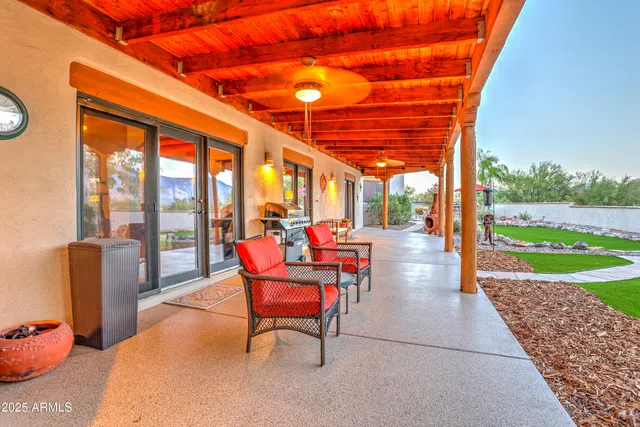 a view of a lake with a table and chairs
