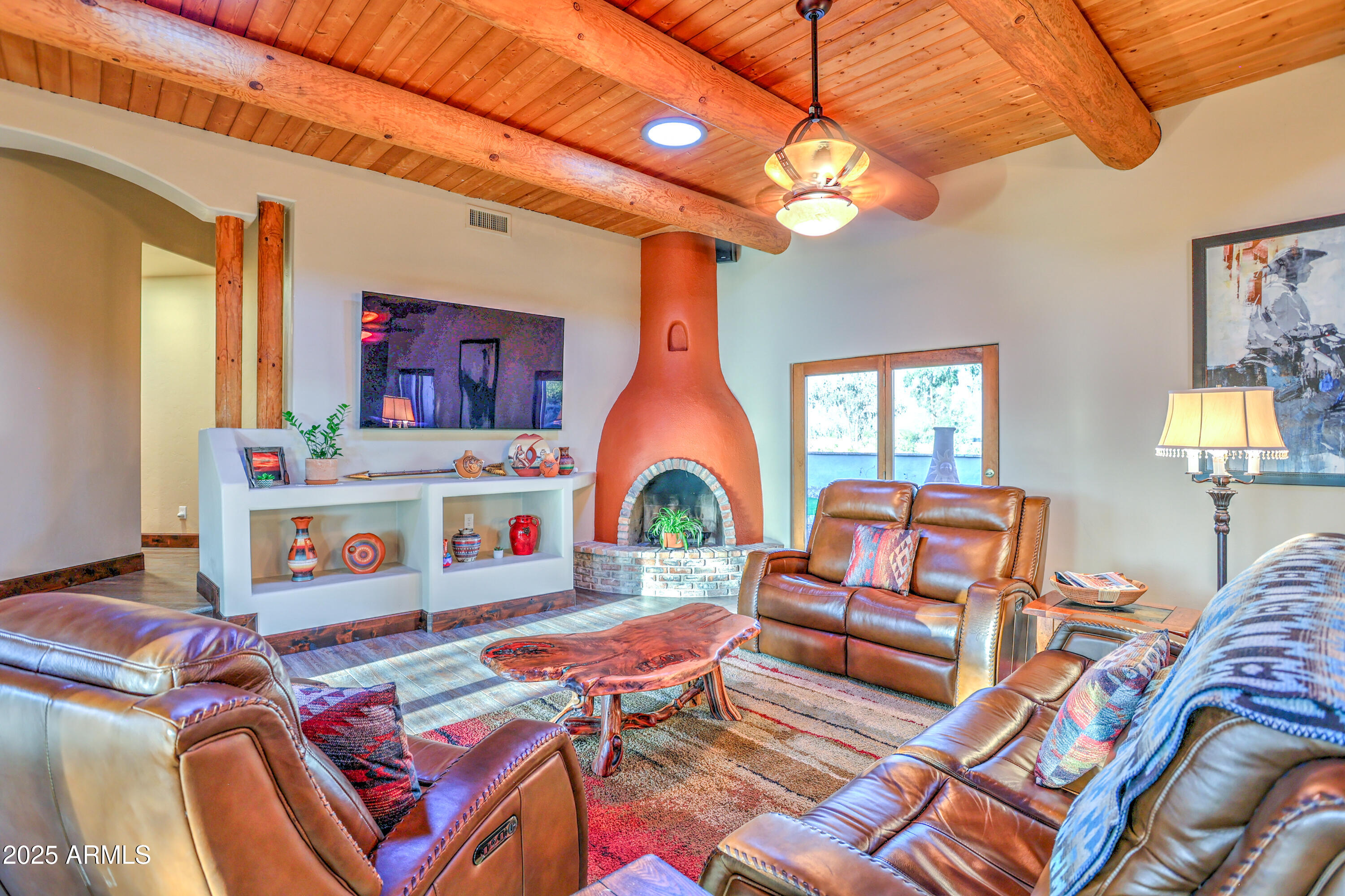 11484 North 1st Avenue Tucson, AZ 85737 - Photo 19 of 47 a living room with lots of furniture and a chandelier