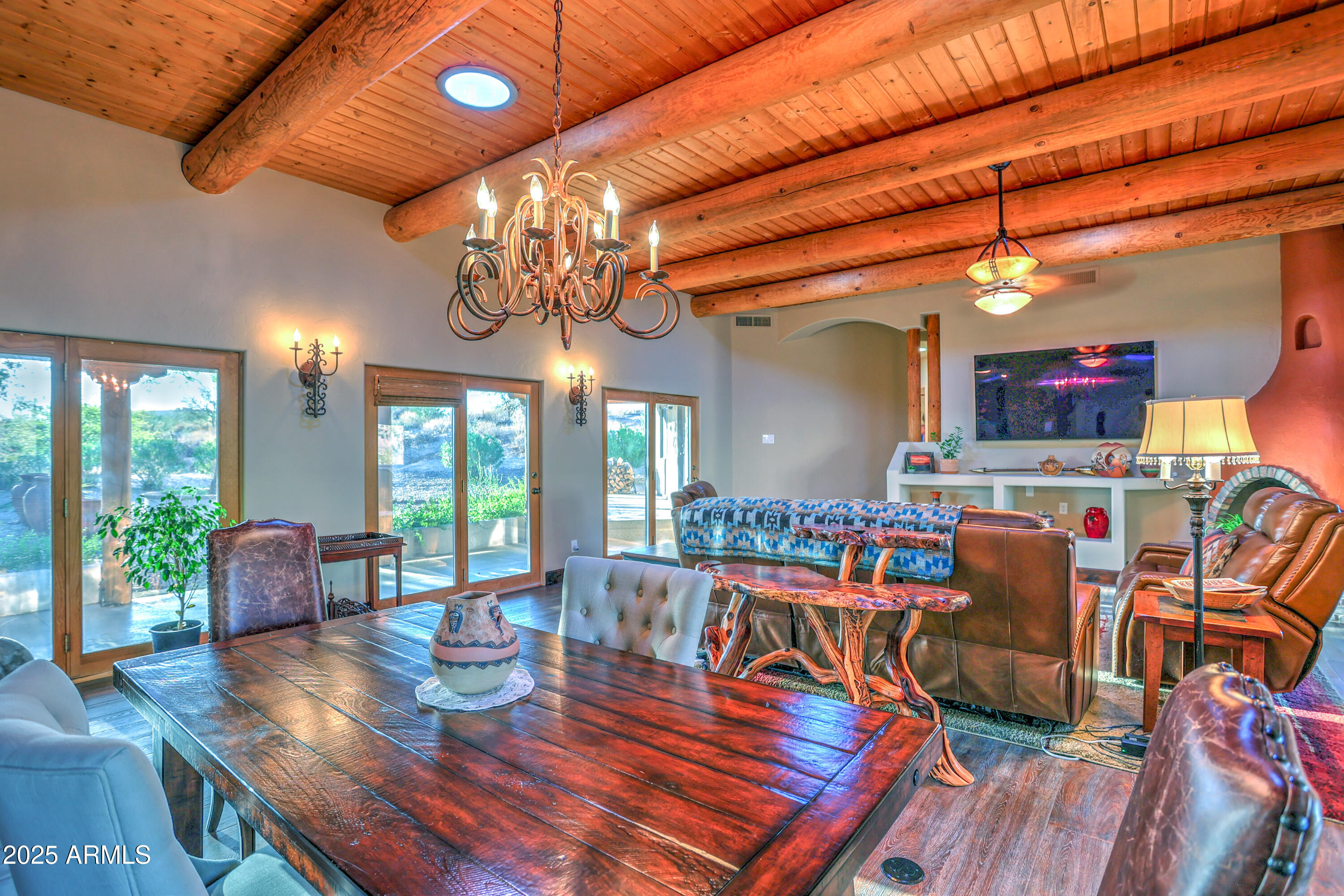 11484 North 1st Avenue Tucson, AZ 85737 - Photo 20 of 47 a view of a dining room with furniture a chandelier and wooden floor