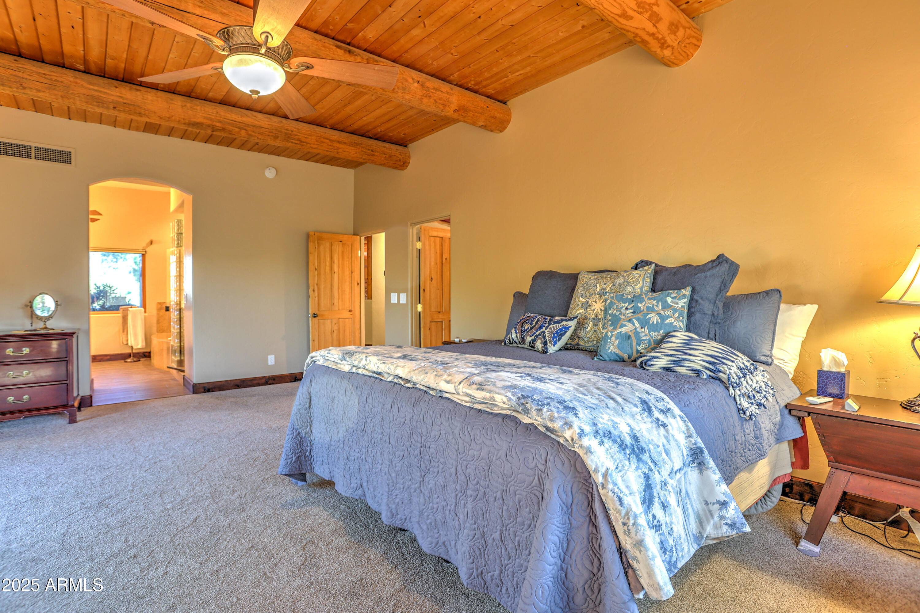 11484 North 1st Avenue Tucson, AZ 85737 - Photo 27 of 47 a spacious bedroom with a bed and a cabinets