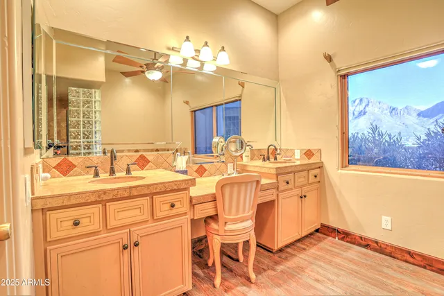 a spacious bedroom with a bed and a cabinets