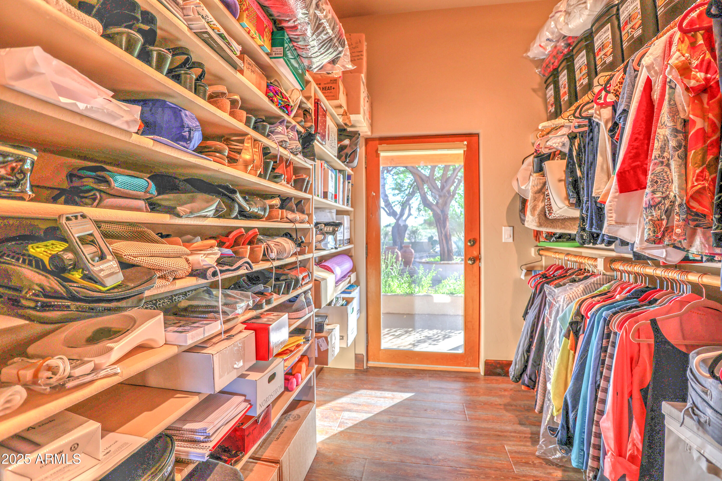 11484 North 1st Avenue Tucson, AZ 85737 - Photo 29 of 47 a view of walk in closet with clothes and shoes