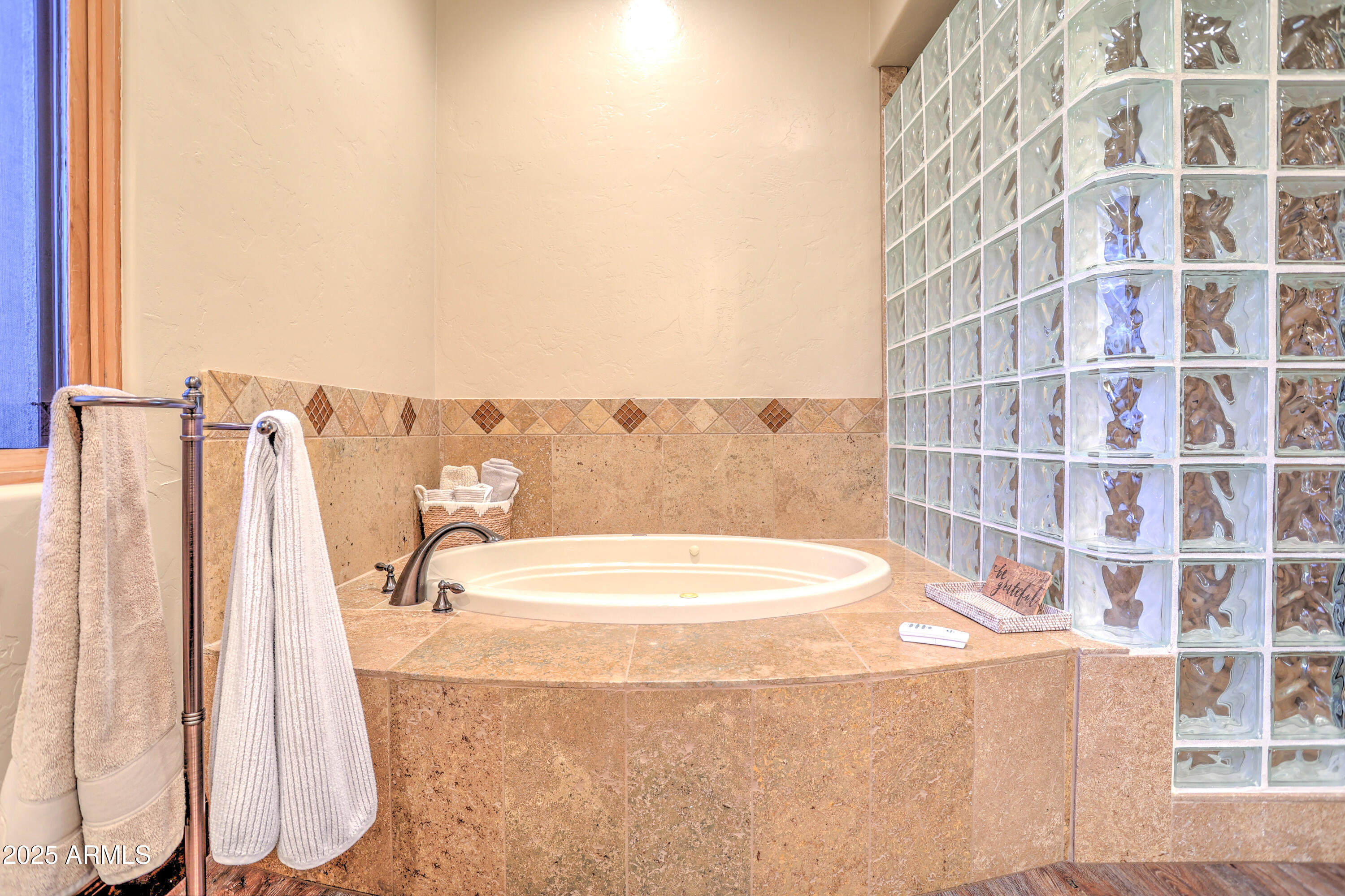 11484 North 1st Avenue Tucson, AZ 85737 - Photo 31 of 47 a bathroom with a bathtub and a shower