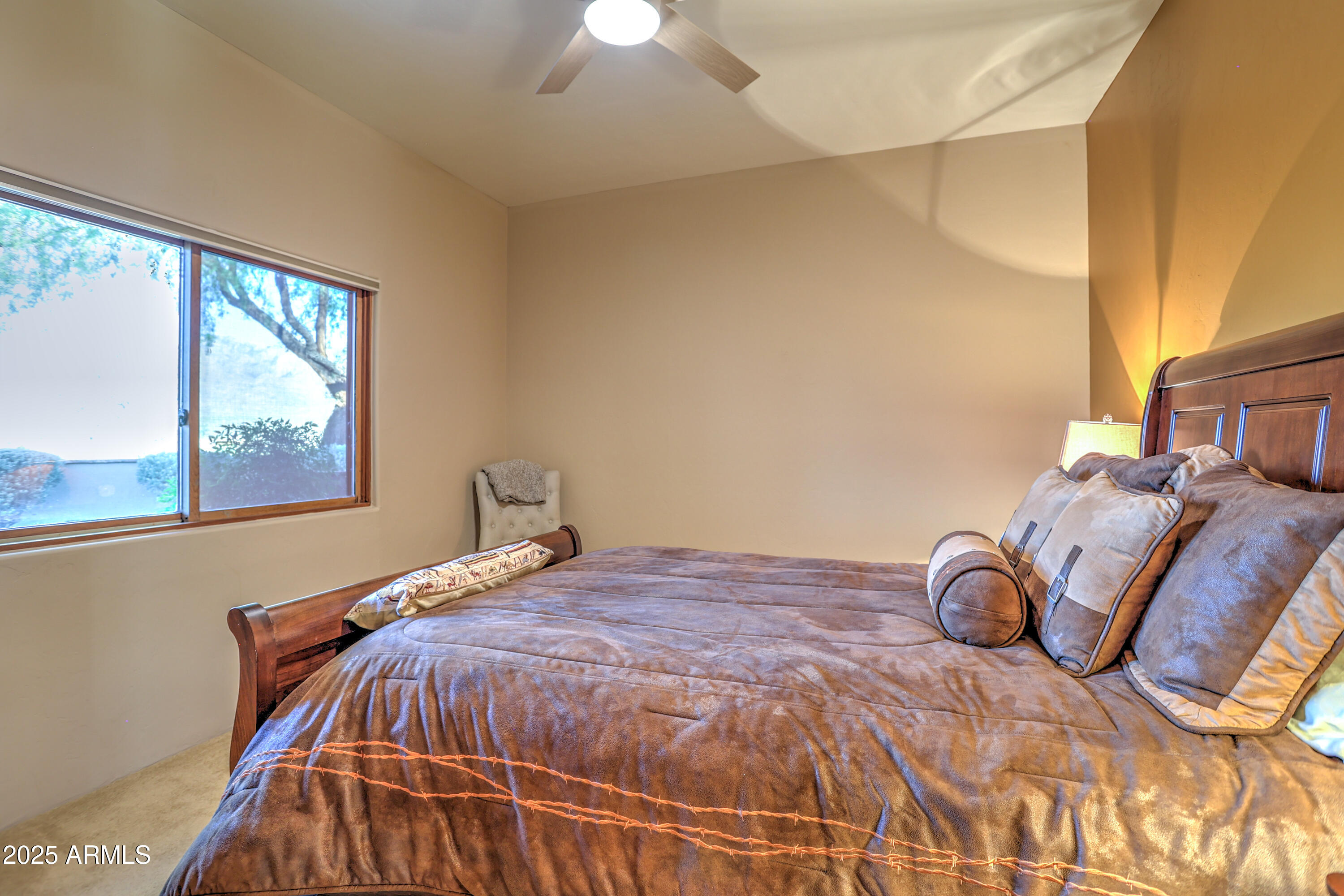 11484 North 1st Avenue Tucson, AZ 85737 - Photo 35 of 47 a bedroom with a bed and a window