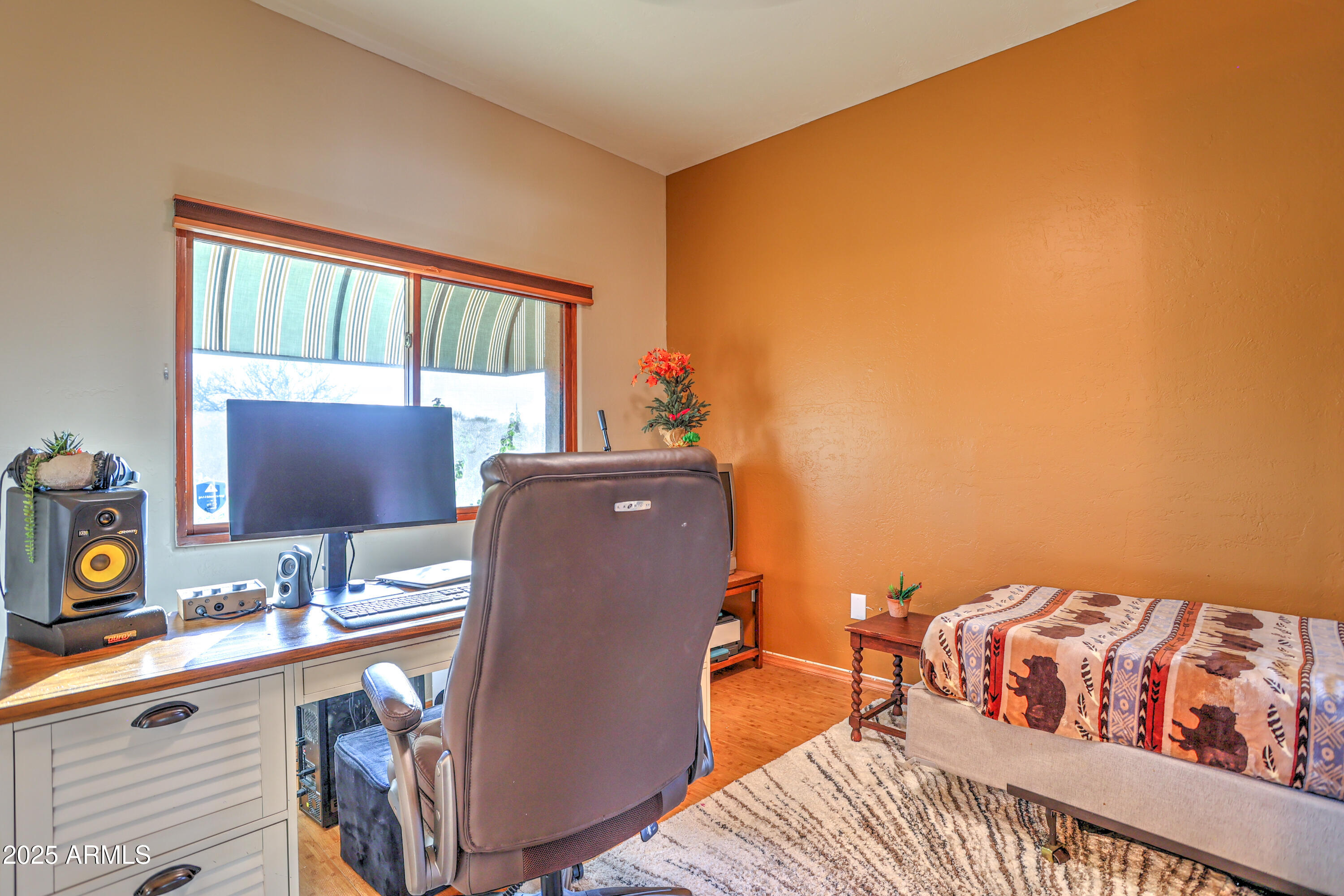 11484 North 1st Avenue Tucson, AZ 85737 - Photo 39 of 47 a bed room with a bed and a chair