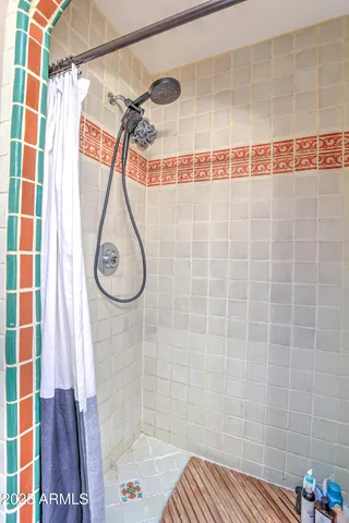 a bed room with a bed and a chair