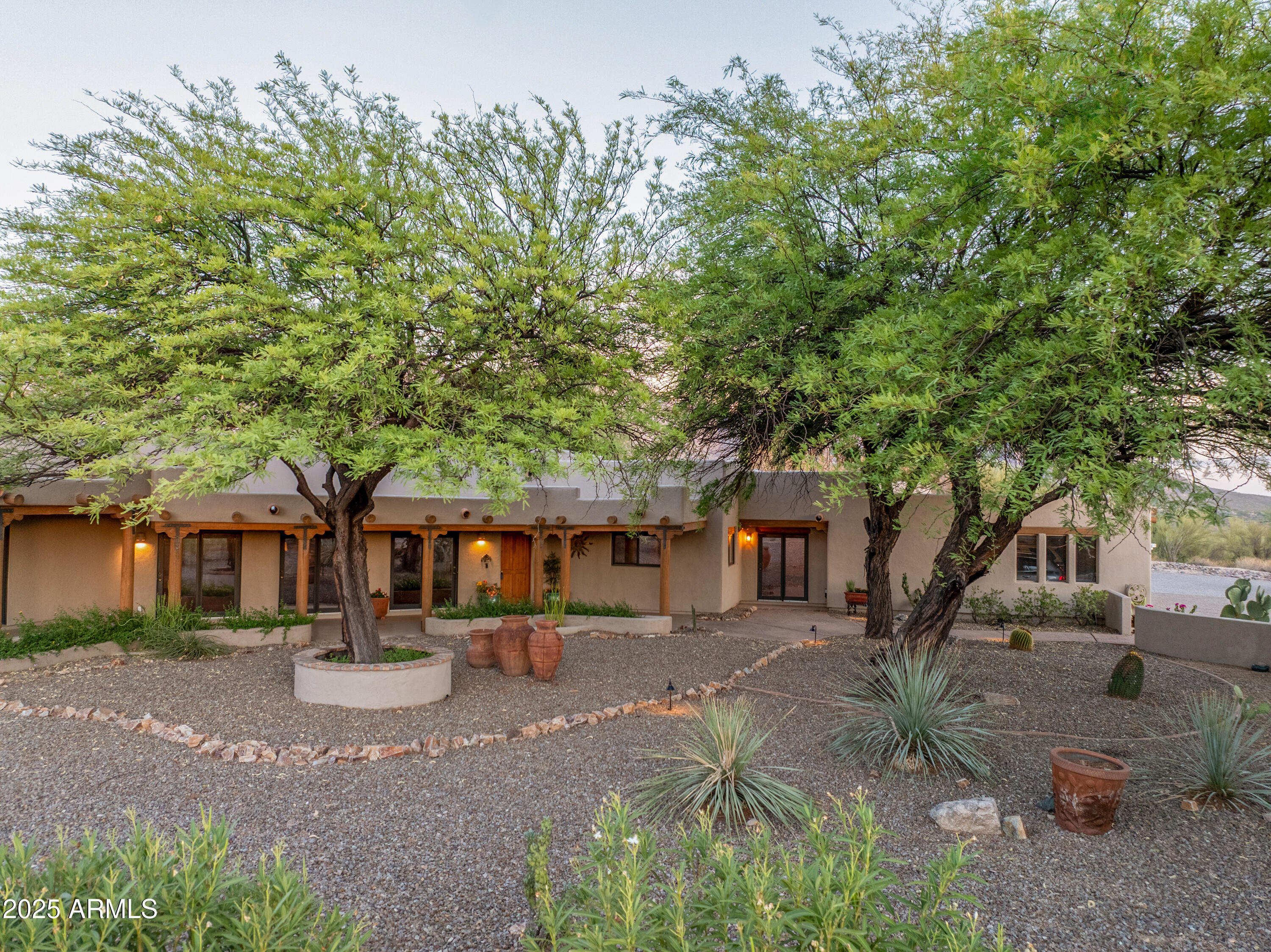 11484 North 1st Avenue Tucson, AZ 85737 - Photo 4 of 47 a front view of a house with garden