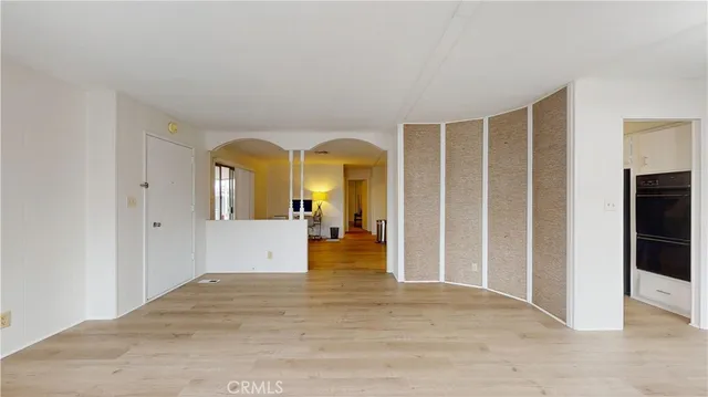 a view of a living room with a large window
