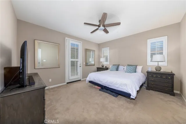 a spacious bedroom with a bed and furniture