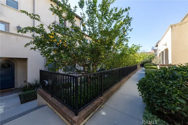 a balcony with wooden floor in front of house