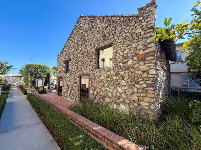 a view of a pathway both side of house