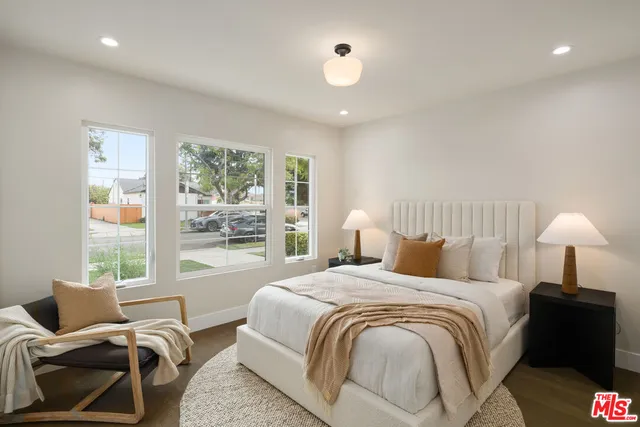 a living room with furniture potted plant and a window