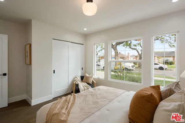 a living room with furniture potted plant and a window