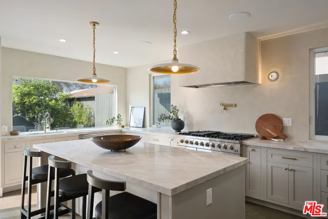a kitchen with a stove and a sink
