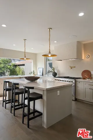 a closeup of a sink with a view of living room