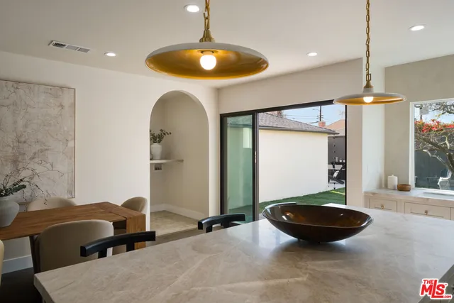 a bedroom with a large bed and a couch