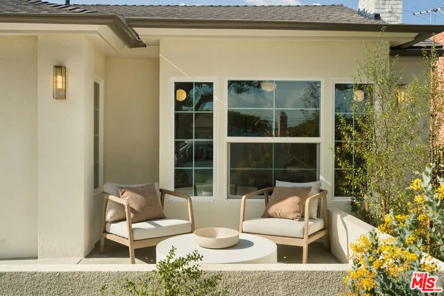 a outdoor living space with furniture and a potted plant