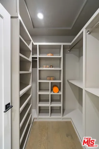 a bathroom with a double vanity sink toilet and shower