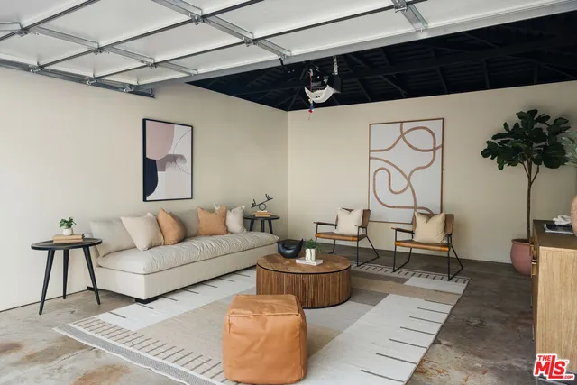 a house view with a sitting space and garden