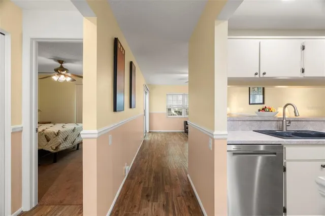 a view of living room with furniture and wooden floor
