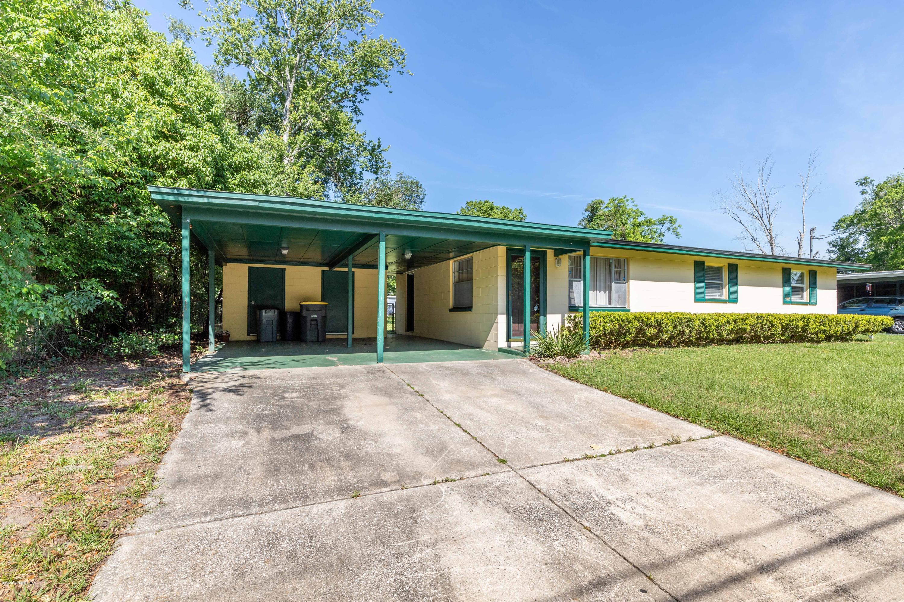 5908 Ensenada Road Jacksonville, FL 32244 - Photo 12 of 30 a view of a house with yard and a garden