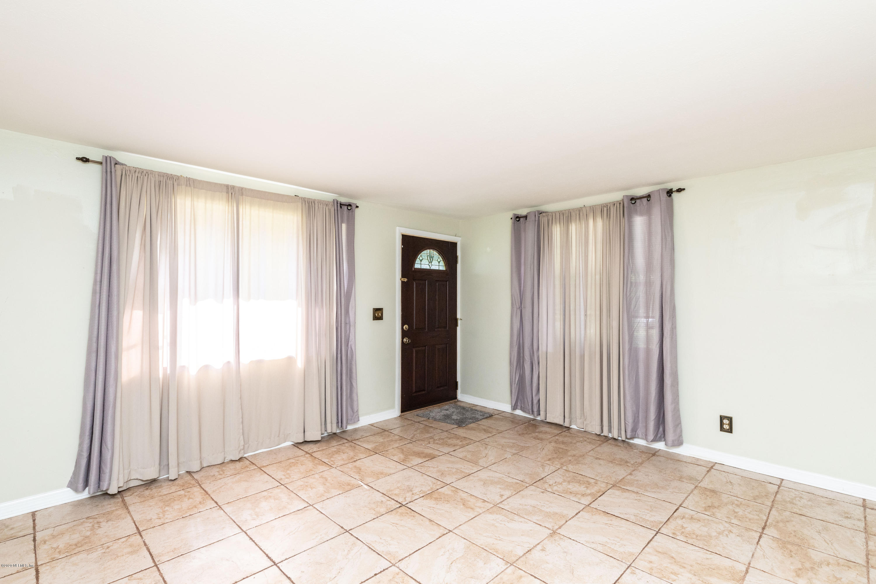 5908 Ensenada Road Jacksonville, FL 32244 - Photo 13 of 30 a view of an empty room and window
