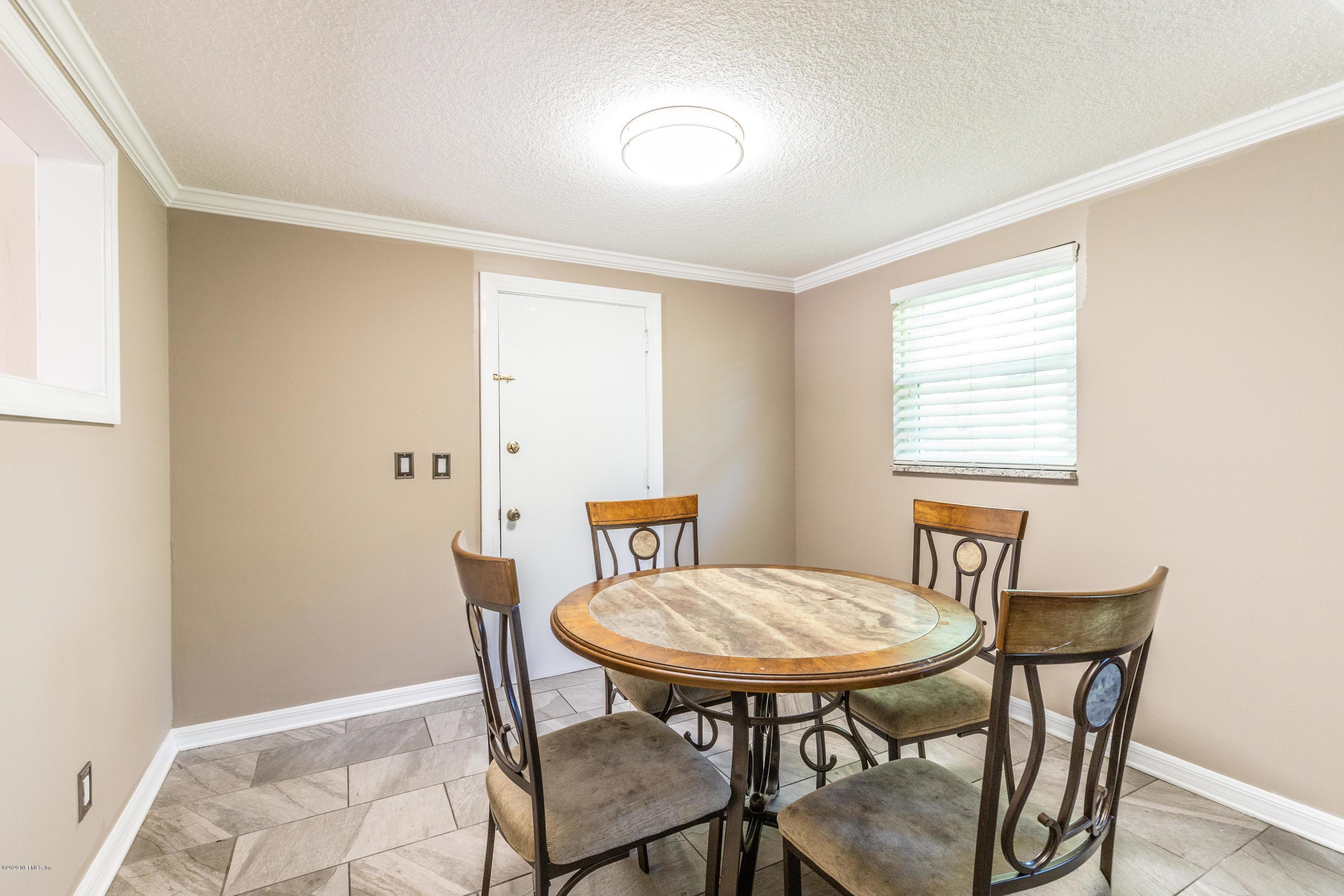 5908 Ensenada Road Jacksonville, FL 32244 - Photo 18 of 30 a view of a room with furniture and wooden floor