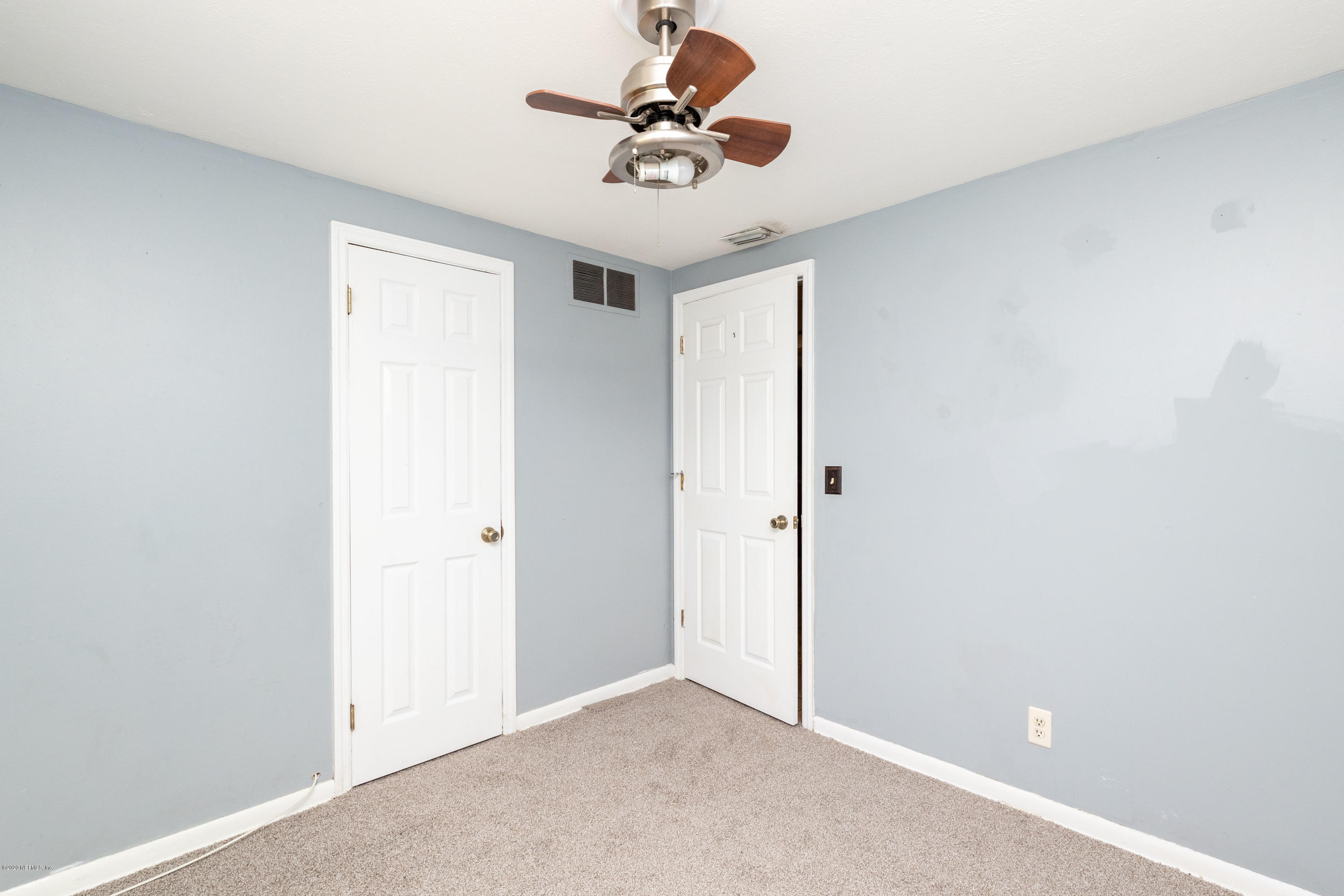 5908 Ensenada Road Jacksonville, FL 32244 - Photo 26 of 30 a view of a room with a ceiling fan