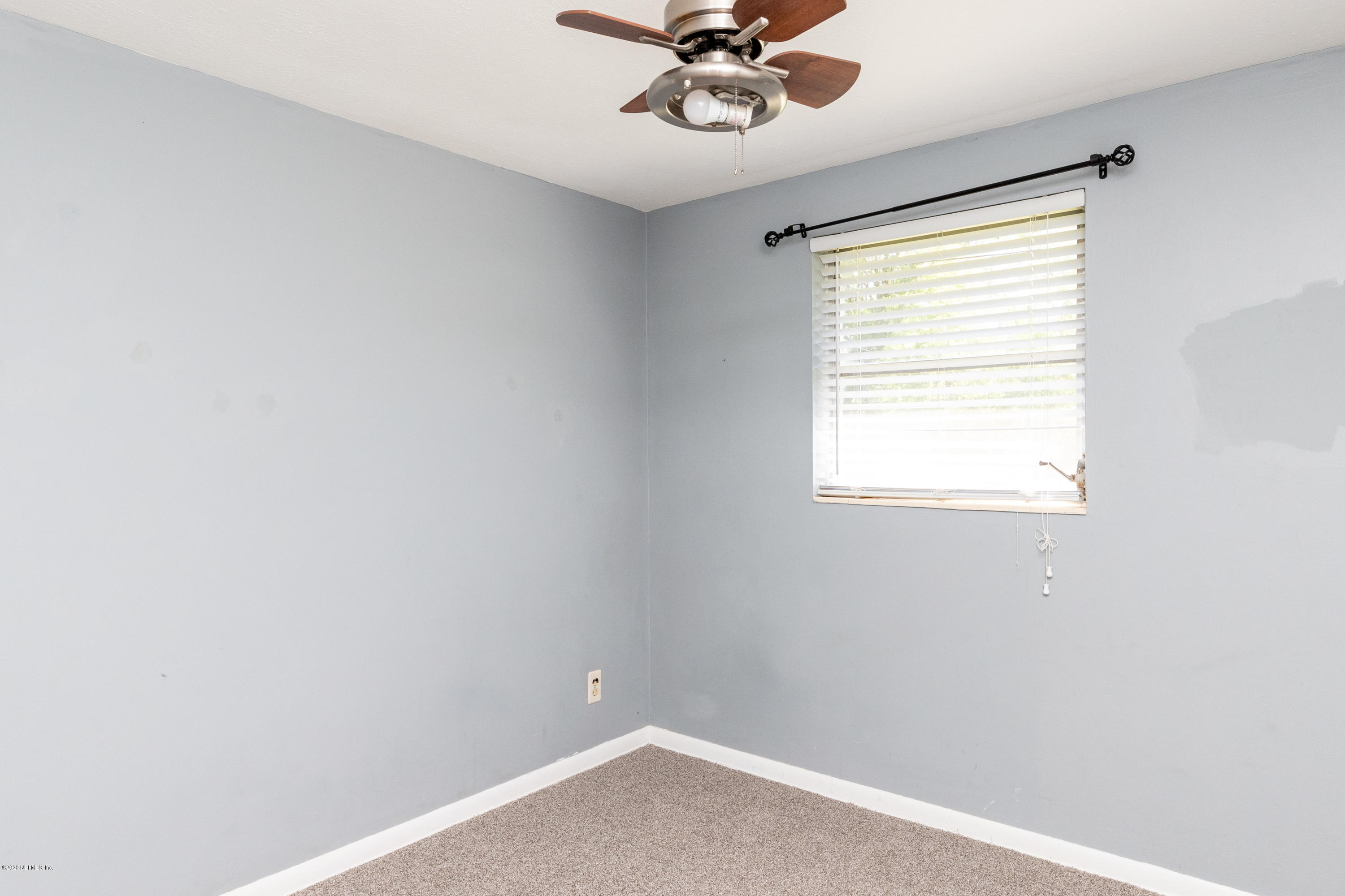 5908 Ensenada Road Jacksonville, FL 32244 - Photo 27 of 30 a view of an empty room with a window