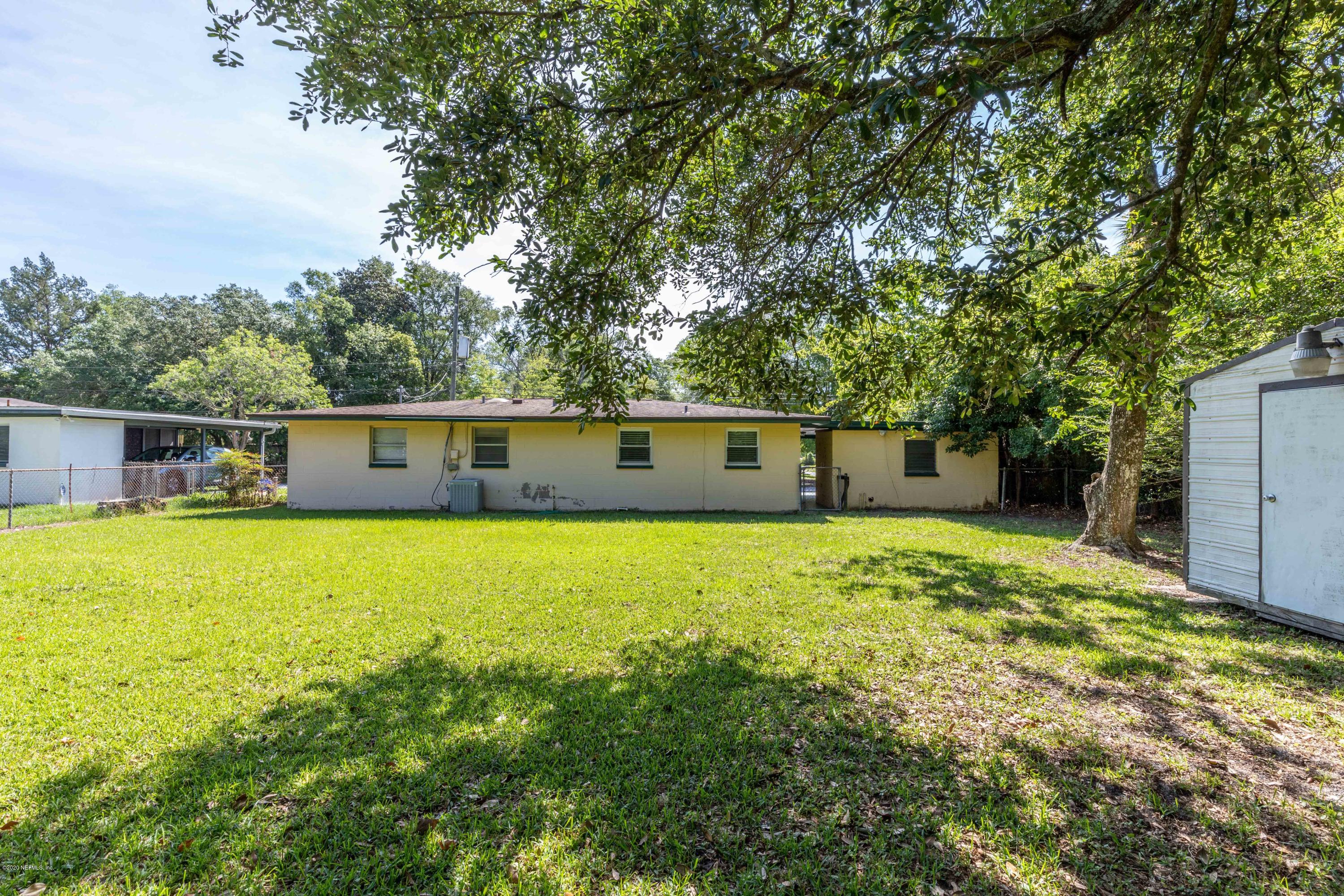 5908 Ensenada Road Jacksonville, FL 32244 - Photo 28 of 30 a front view of a house with a yard