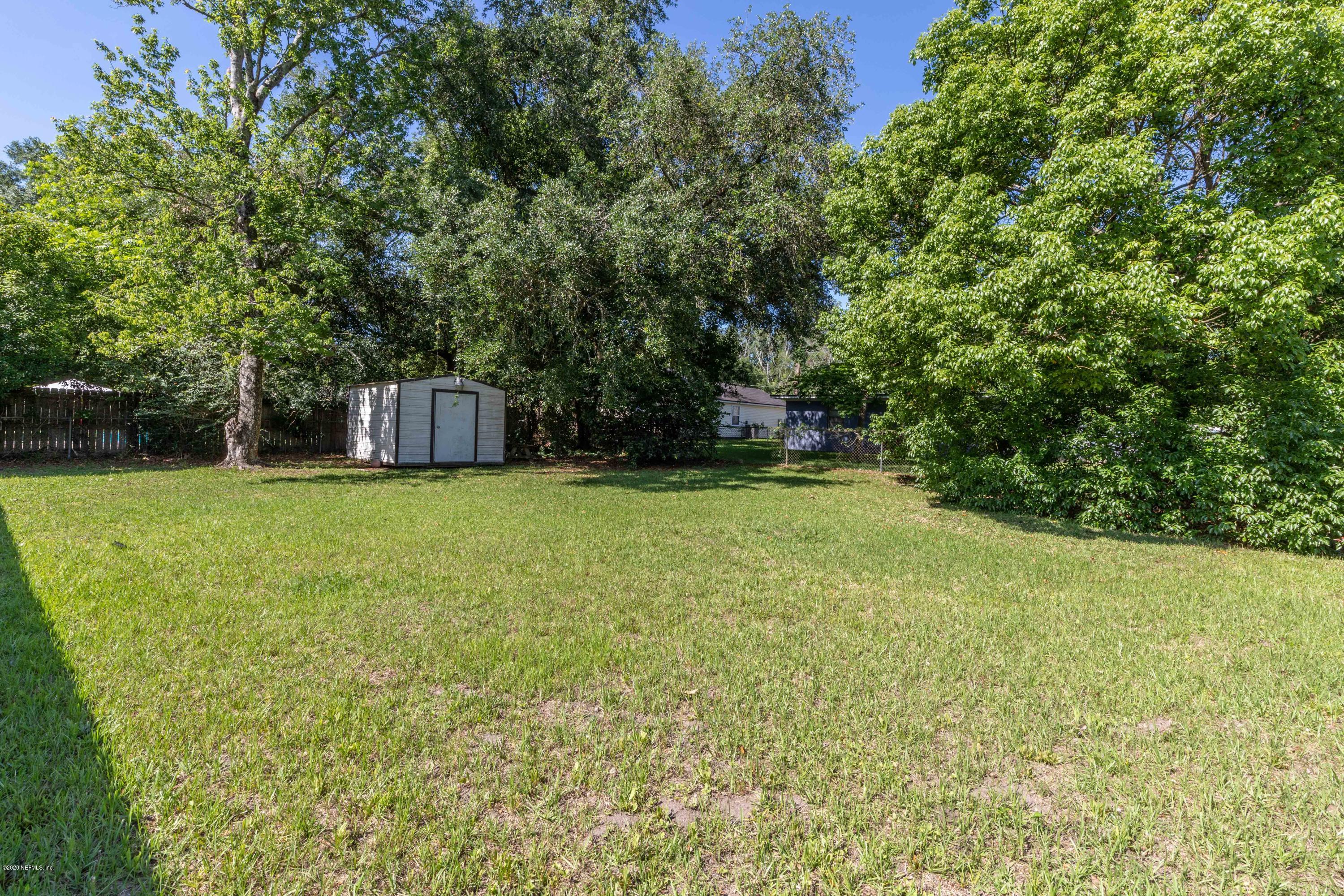 5908 Ensenada Road Jacksonville, FL 32244 - Photo 29 of 30 a view of a tree in a yard