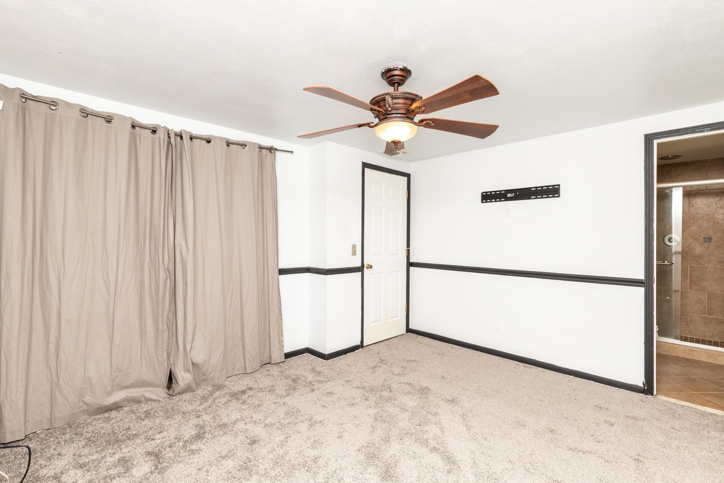 5908 Ensenada Road Jacksonville, FL 32244 - Photo 6 of 30 a view of a refrigerator with a ceiling fan