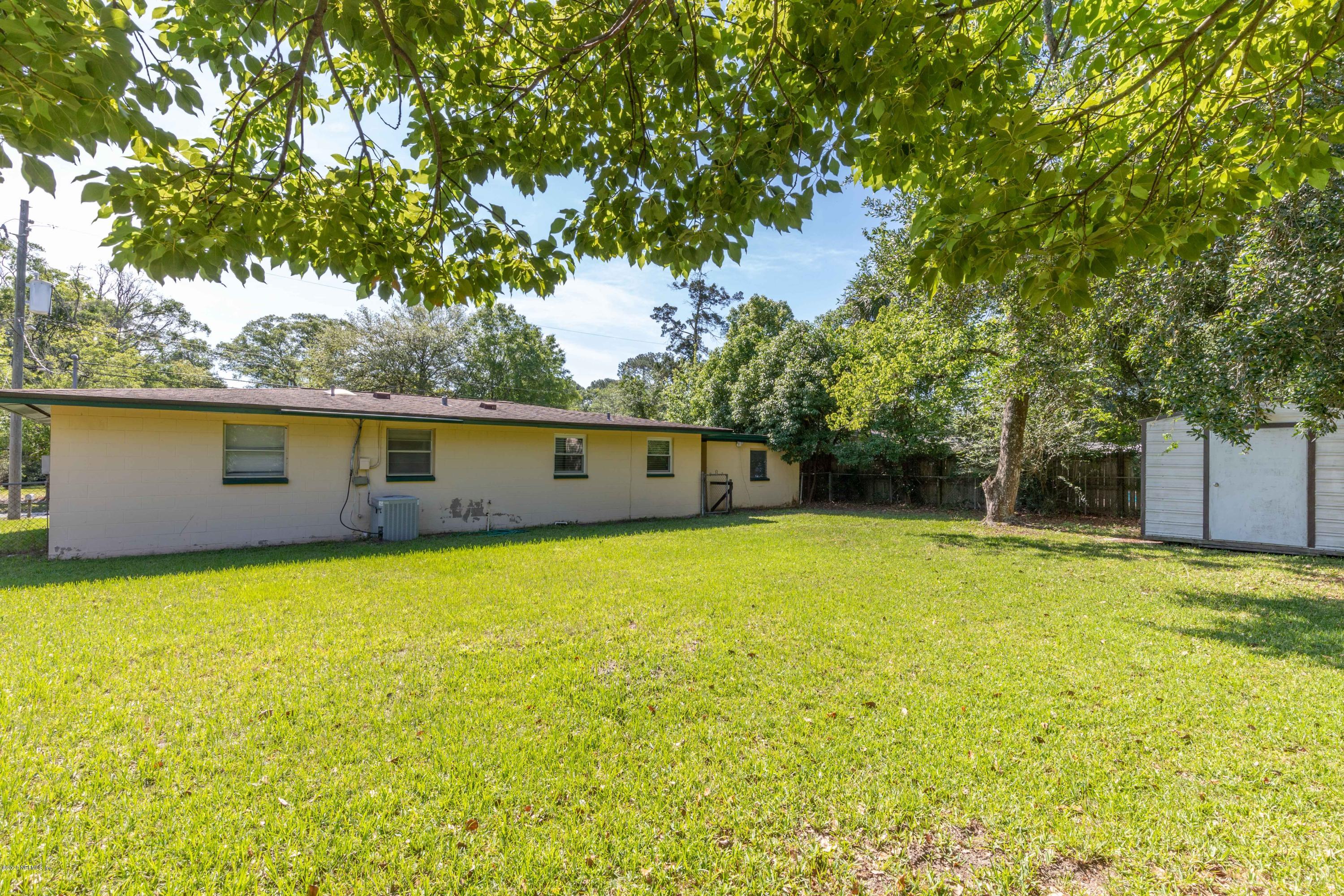 5908 Ensenada Road Jacksonville, FL 32244 - Photo 9 of 30 a view of a house with a yard
