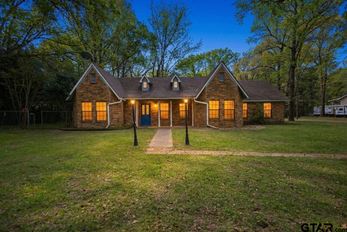 15938 Big Oak Bay Road Tyler, TX 75707 - Photo 1 of 21 a view of a house with a yard