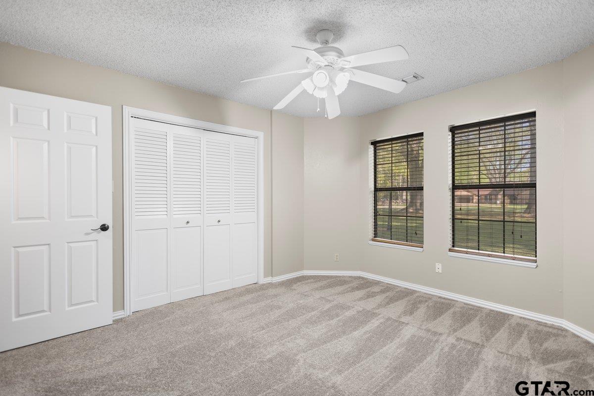 15938 Big Oak Bay Road Tyler, TX 75707 - Photo 18 of 21 a view of an empty room with a window