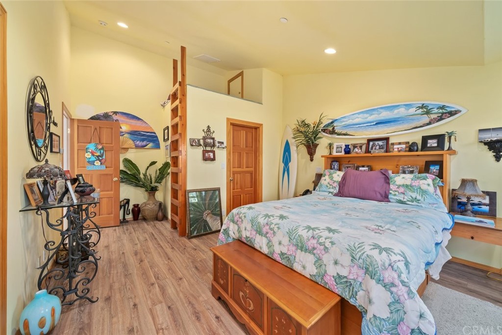 4124 North Ryan Road Creston, CA 93432 - Photo 30 of 75 a bedroom with a bed and wooden floor