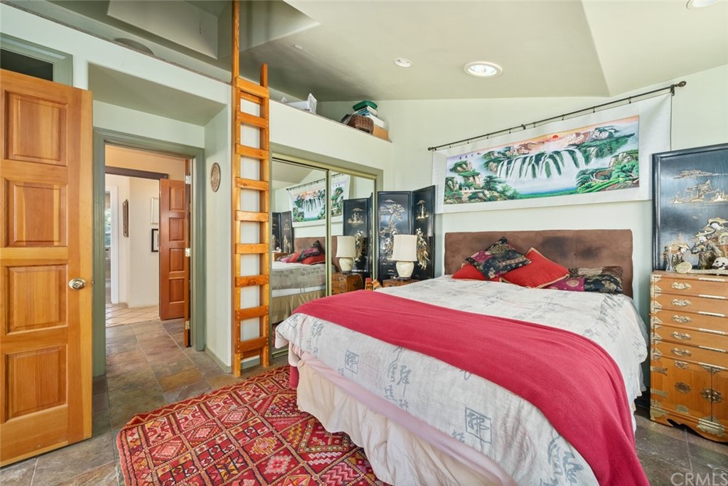 4124 North Ryan Road Creston, CA 93432 - Photo 44 of 75 a bedroom with a large bed and a chandelier