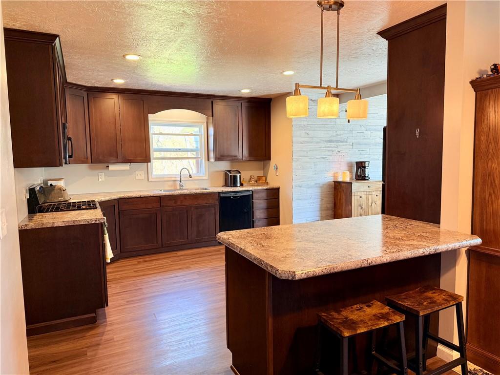 2459 Doc Walker Road Parker, PA 16049 - Photo 5 of 18 a kitchen with a wooden floor and a refrigerator