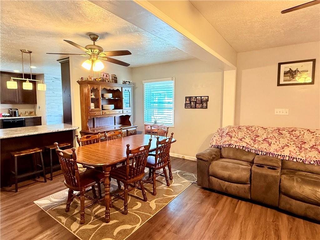 2459 Doc Walker Road Parker, PA 16049 - Photo 6 of 18 a view of a dining room with furniture and wooden floor