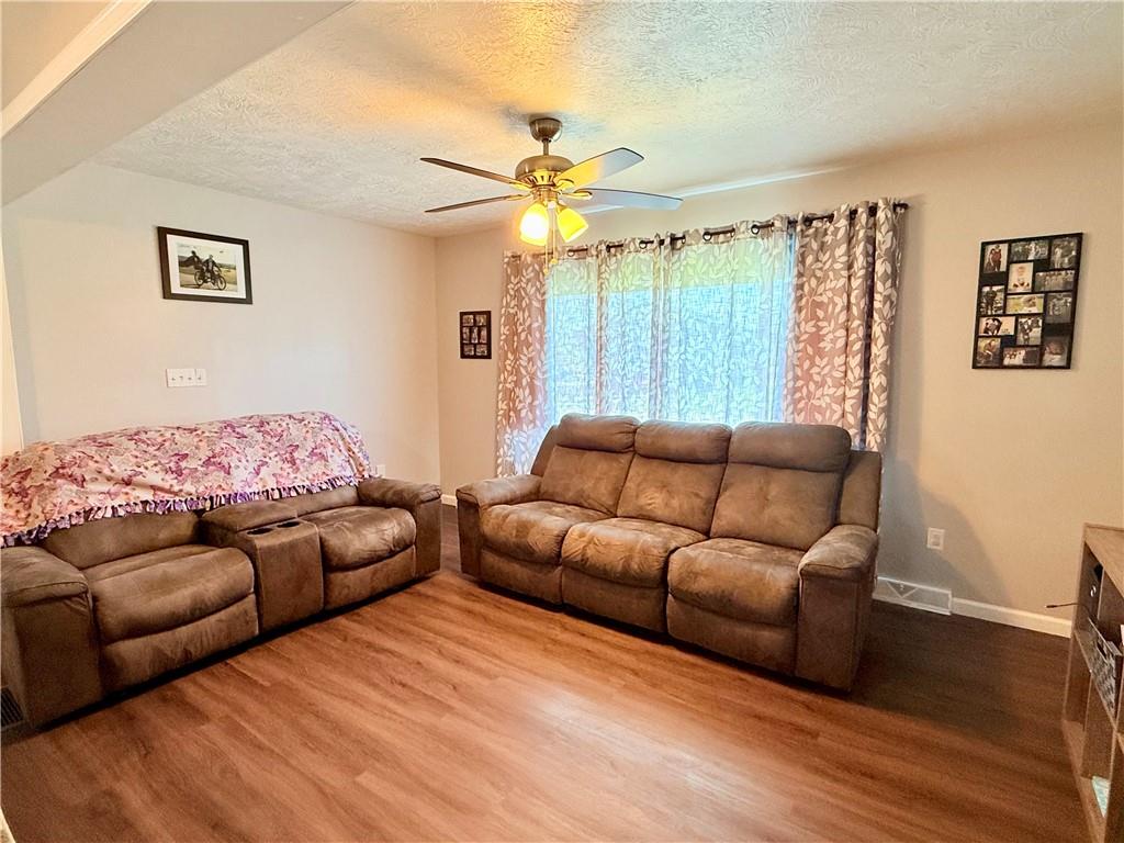 2459 Doc Walker Road Parker, PA 16049 - Photo 7 of 18 a living room with furniture and a wooden floor