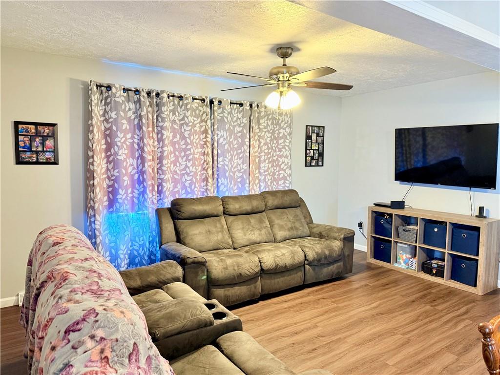 2459 Doc Walker Road Parker, PA 16049 - Photo 8 of 18 a living room with furniture and a flat screen tv