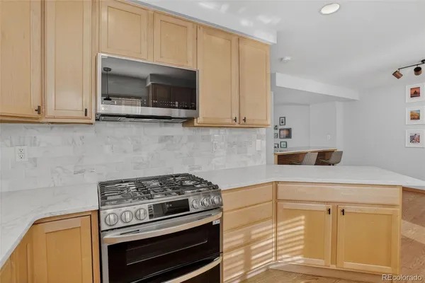 a kitchen with a stove and a microwave
