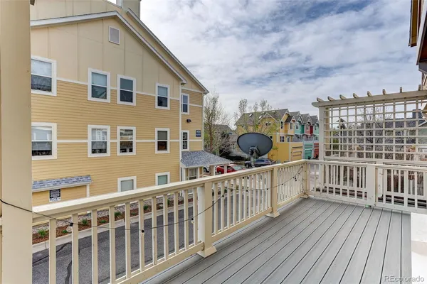 a view of a balcony with wooden floor
