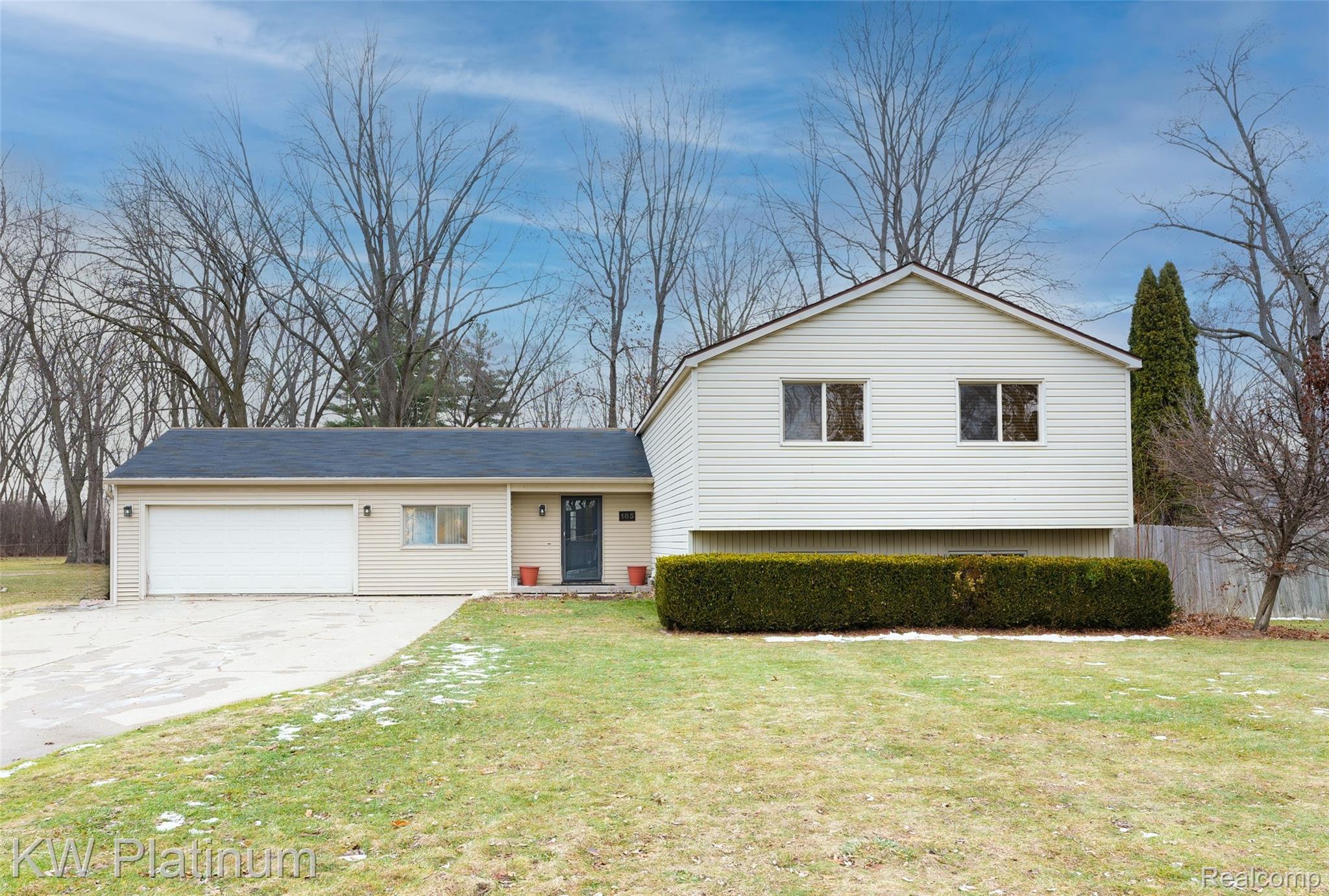 185 Michelson Road Rochester, MI 48307 - Photo 2 of 36 Split level home featuring an attached garage and driveway