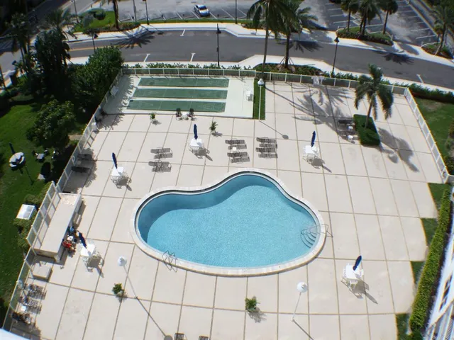 a view of a swimming pool with a patio