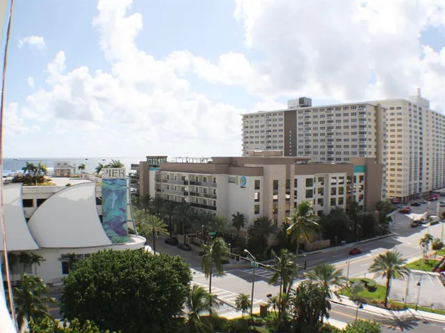 a view of a city with tall buildings