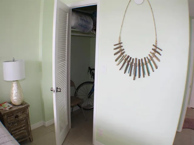 a view of a room that has a bed in it